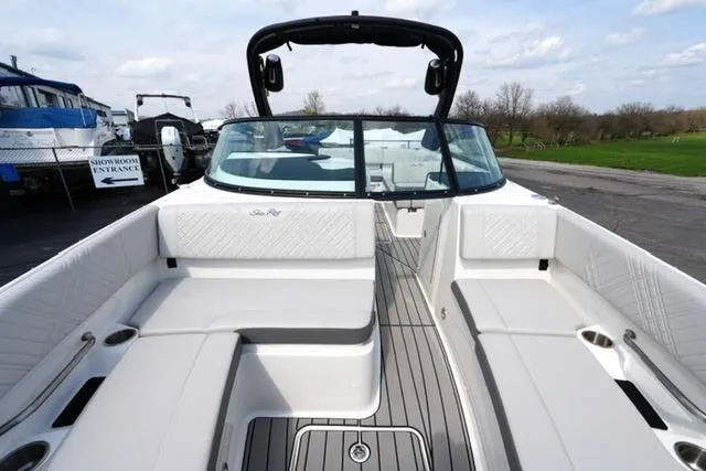Slide: The Image of 2025 Sea Ray SDX 270 boat interior with spacious seating and sleek design. - 11