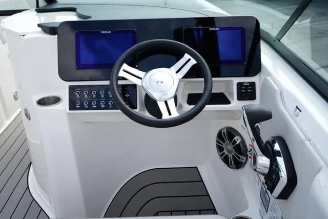 Slide: The Image of 2025 Sea Ray SDX 270 helm with dual displays and modern controls. - 14
