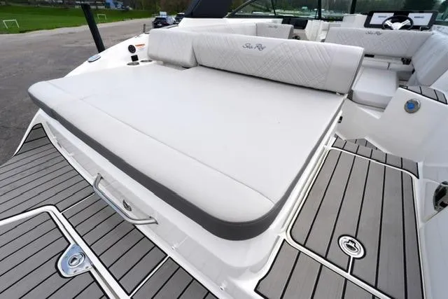 Slide: The Image of 2025 Sea Ray SDX 270 boat with spacious sunpad and sleek deck design. - 18