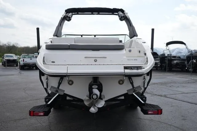 Slide: The Image of 2025 Sea Ray SDX 270 boat on trailer, rear view in parking lot. - 6