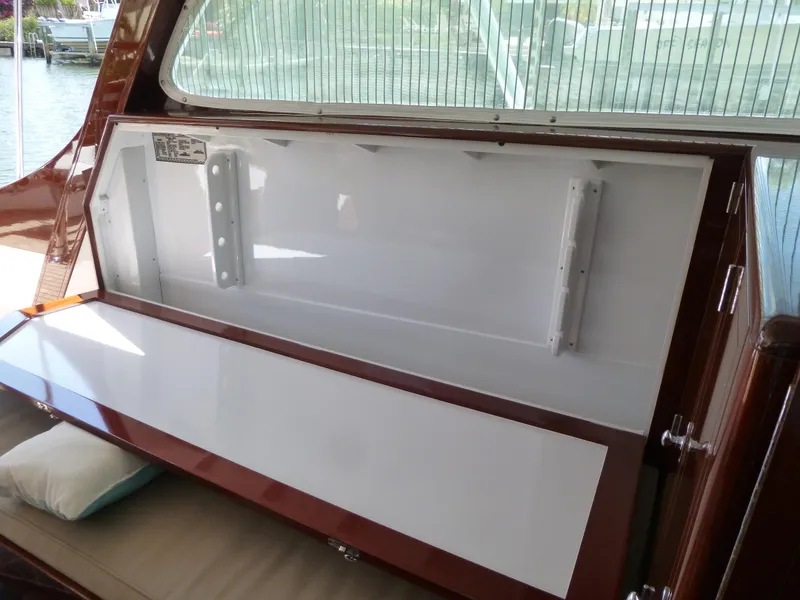 Slide: The Image of 1949 Rybovich Sport Fish boat interior with open storage compartment. - 26