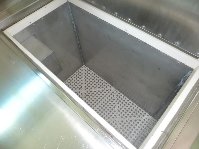 Slide: The Image of Stainless steel storage compartment on a 1949 Rybovich Sport Fish boat. - 32