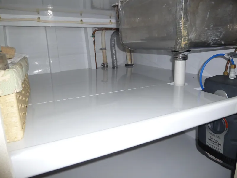 Slide: The Image of 1949 Rybovich Sport Fish interior with sink and storage area. - 35