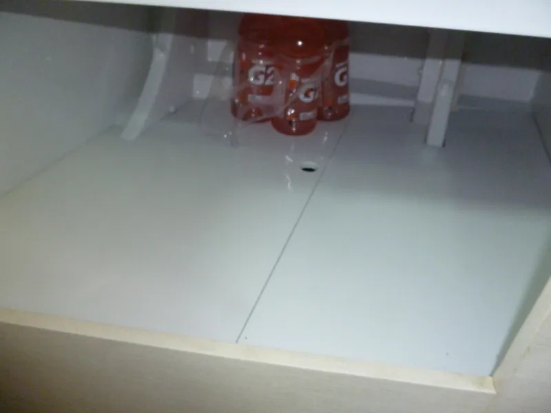 Slide: The Image of Empty white storage space with Gatorade bottles inside. - 41