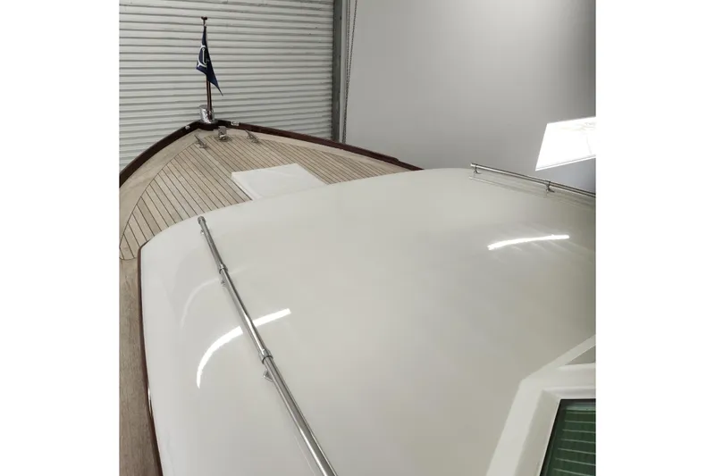 Slide: The Image of 1949 Rybovich Sport Fish boat with sleek deck and classic design. - 93