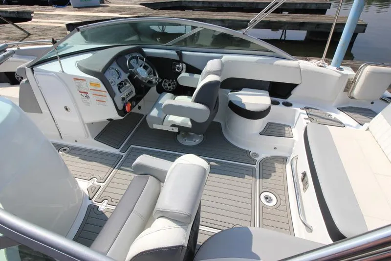 Slide: The Image of 2015 Cruisers Sport Series 238 Bow Rider interior with seating and dashboard view. - 11