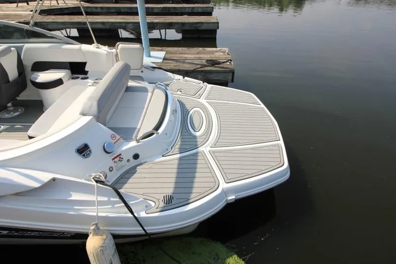 Slide: The Image of 2015 Cruisers Sport Series 238 Bow Rider at dock, showcasing spacious swim platform. - 12