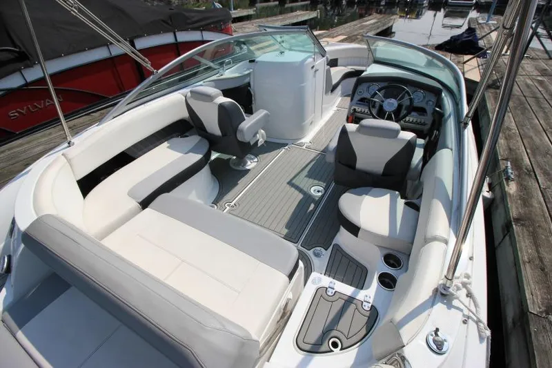 Slide: The Image of 2015 Cruisers Sport Series 238 Bow Rider with spacious seating and modern dashboard. - 15