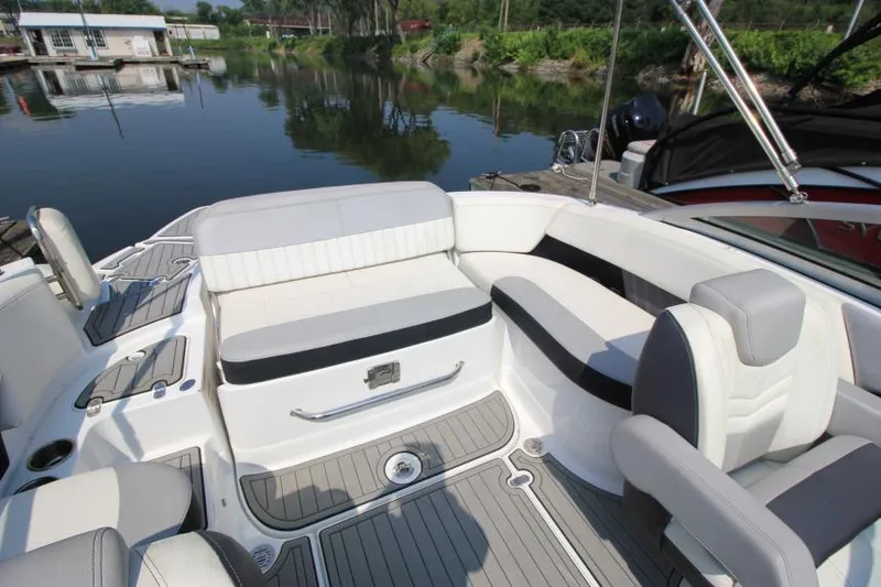 Slide: The Image of 2015 Cruisers Sport Series 238 Bow Rider interior with seating and water view. - 16