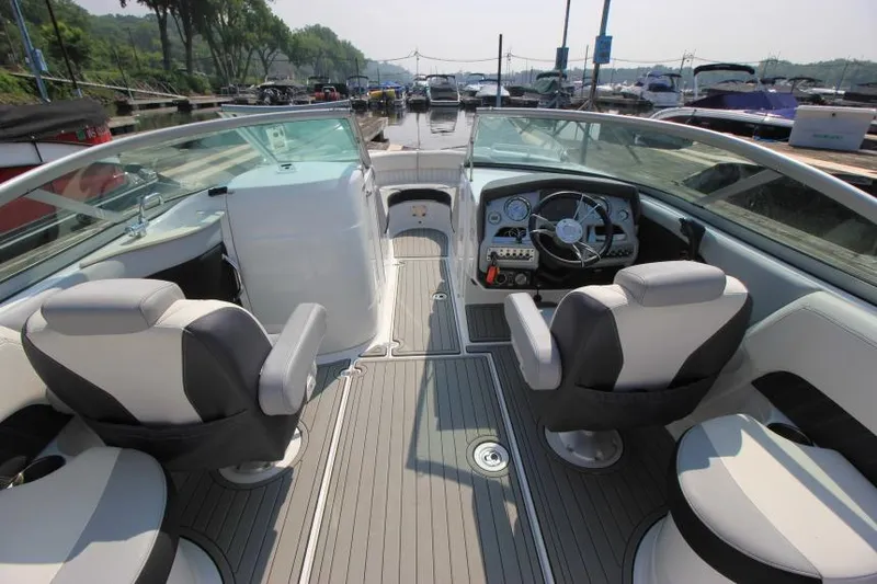 Slide: The Image of 2015 Cruisers Sport Series 238 Bow Rider interior with steering wheel and seating. - 19