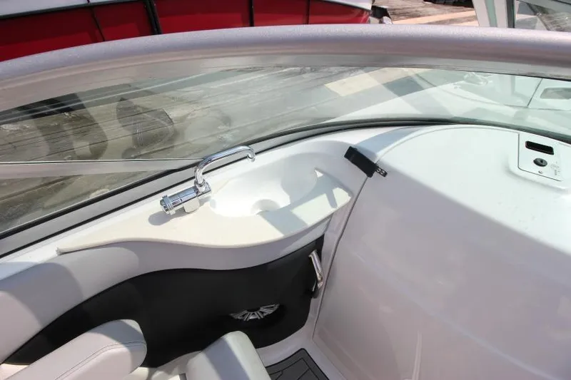 Slide: The Image of 2015 Cruisers Sport Series 238 Bow Rider interior with sink and seating area. - 23