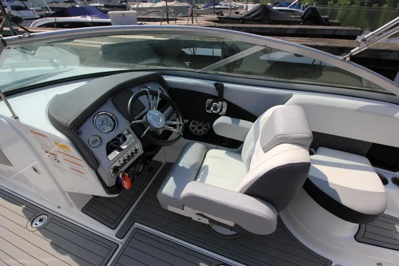 Slide: The Image of 2015 Cruisers Sport Series 238 Bow Rider interior with steering wheel and seating. - 25