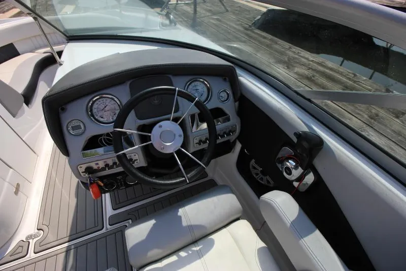 Slide: The Image of 2015 Cruisers Sport Series 238 Bow Rider dashboard with steering wheel and gauges. - 26