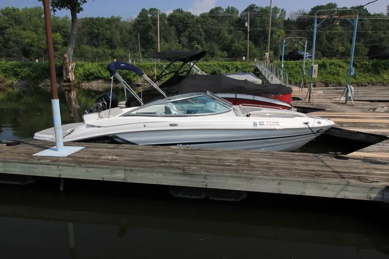 The Image of 2015 Cruisers Sport Series 238 Bow Rider docked at a marina. - 8