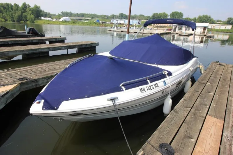 Slide: The Image of 2015 Cruisers Sport Series 238 Bow Rider docked with blue cover. - 9