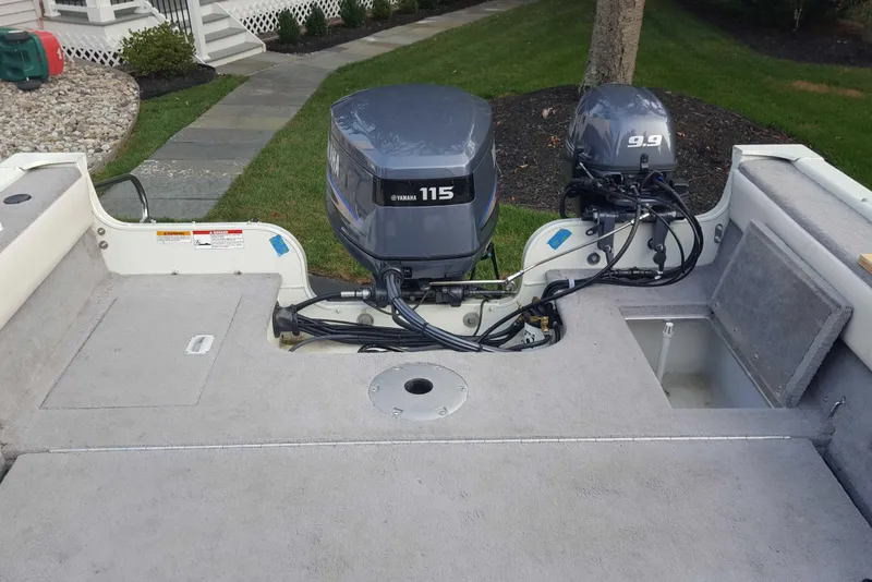 Slide: The Image of Starweld 1800 boat, 2011 model, featuring dual Yamaha outboard motors, parked on a driveway. - 21