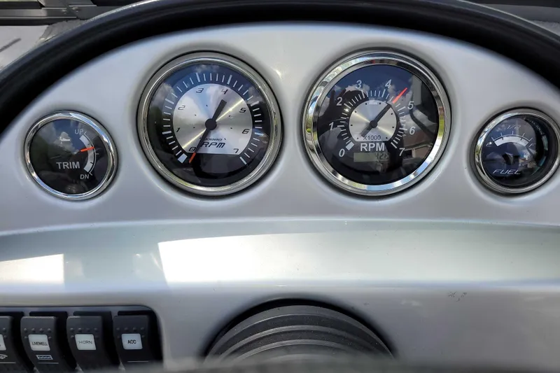 Slide: The Image of Dashboard of a 2011 Starweld 1800 boat showing RPM, trim, and fuel gauges. - 5