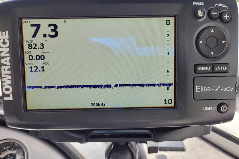 Slide: The Image of Lowrance Elite-7 HDI fishfinder displaying depth, temperature, and voltage on a Starweld 1800, 2011 model. - 6