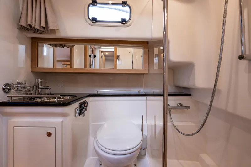 Slide: The Image of Luxurious bathroom in 2022 Nimbus 365 Coupe yacht with modern fixtures and elegant design. - 18