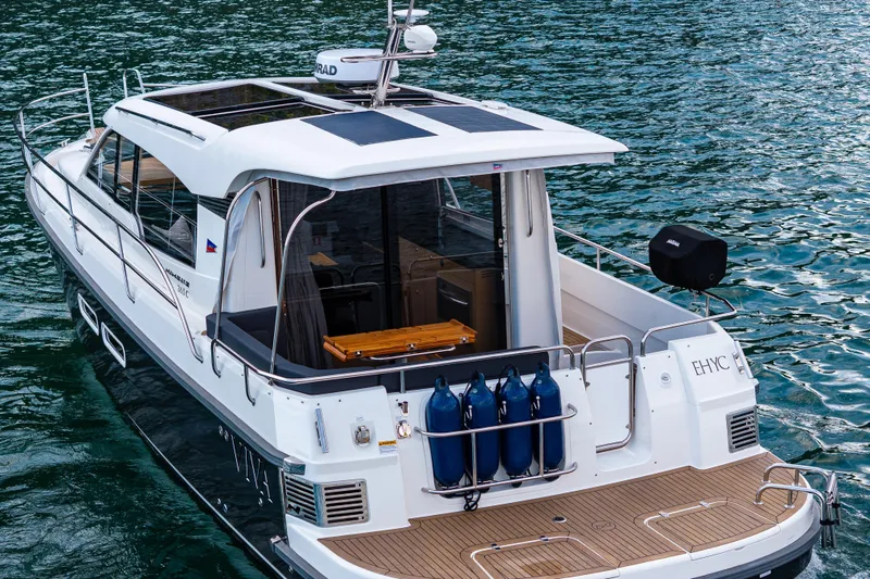 Slide: The Image of 2022 Nimbus 365 Coupe yacht on water, showcasing sleek design and modern features. - 30