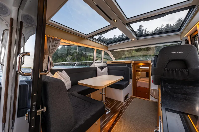 Slide: The Image of Luxurious interior of 2022 Nimbus 365 Coupe with panoramic windows and elegant seating. - 6