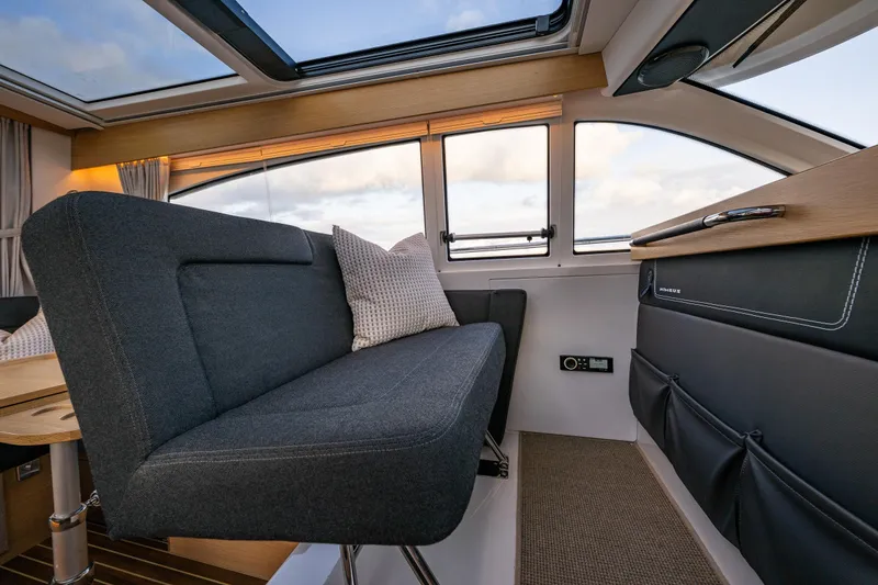 Slide: The Image of Interior of 2022 Nimbus 365 Coupe, featuring sleek seating and modern design elements. - 9