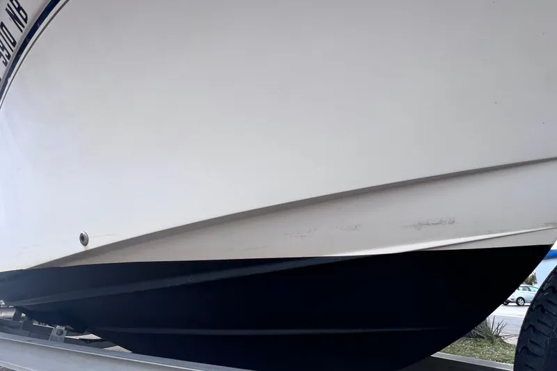 Slide: The Image of 2006 Grady-White Tournament 205 boat hull on trailer, close-up view. - 10