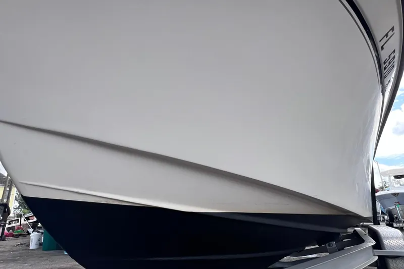 Slide: The Image of 2006 Grady-White Tournament 205 boat hull on trailer, close-up view. - 11
