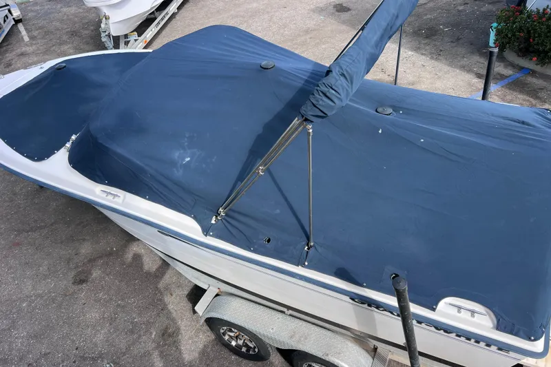 Slide: The Image of 2006 Grady-White Tournament 205 boat with blue cover on trailer. - 13