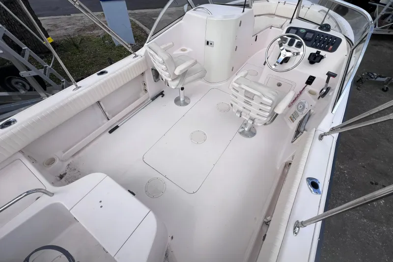 Slide: The Image of 2006 Grady-White Tournament 205 boat interior with steering console and seating. - 15