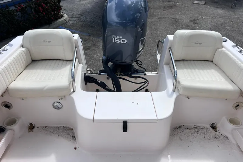 Slide: The Image of 2006 Grady-White Tournament 205 boat with Yamaha 150 engine, featuring white seating. - 18