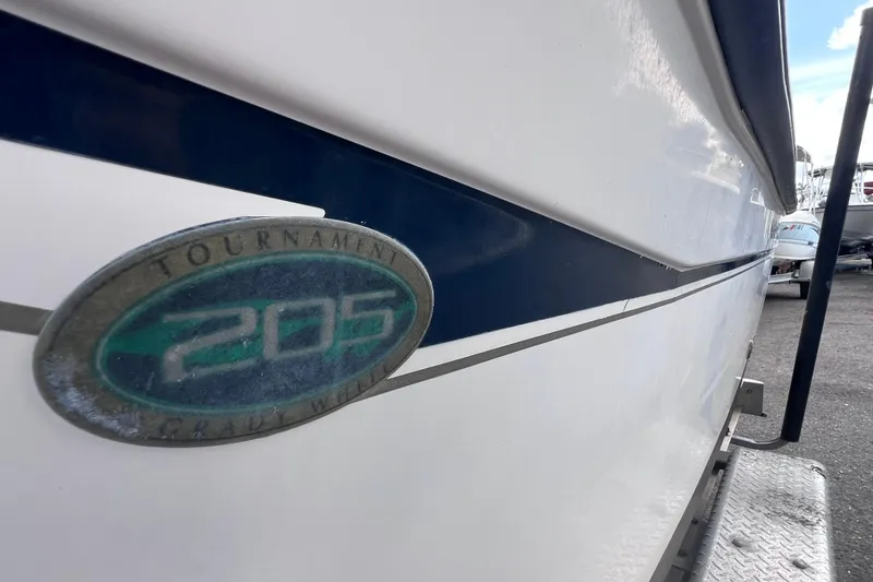 Slide: The Image of 2006 Grady-White Tournament 205 boat with emblem and blue stripe detail. - 2