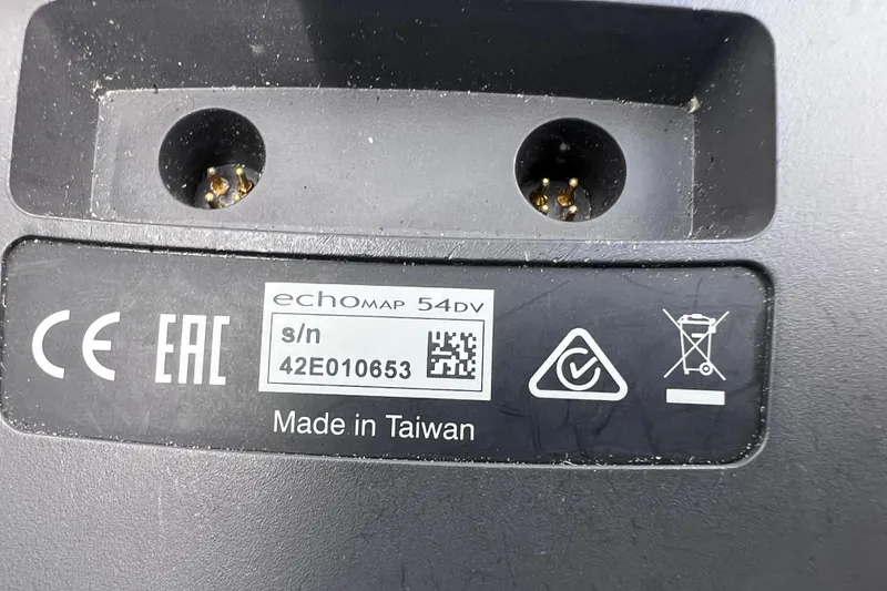 Slide: The Image of Label on electronic device showing serial number, certifications, and "Made in Taiwan" text. - 25