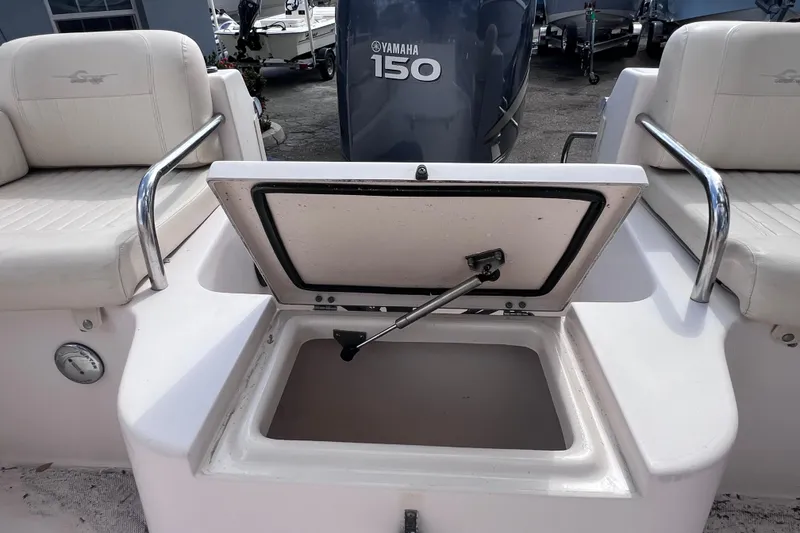 Slide: The Image of 2006 Grady-White Tournament 205 boat with open storage compartment and Yamaha 150 engine. - 29