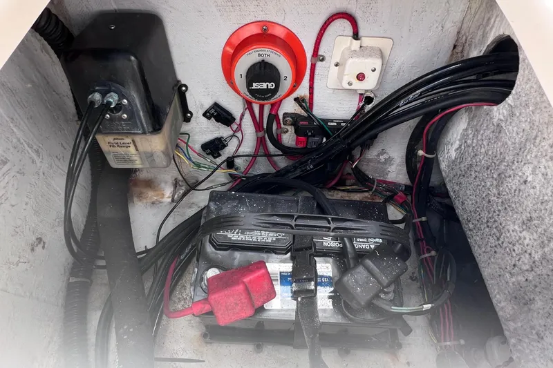 Slide: The Image of Electrical components and wiring inside a 2006 Grady-White Tournament 205 boat. - 30