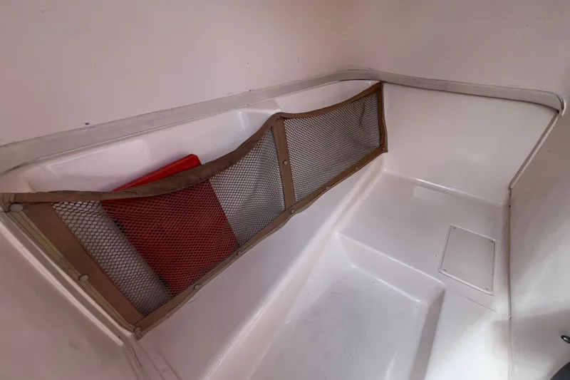 Slide: The Image of Interior storage area of 2006 Grady-White Tournament 205 boat with mesh netting. - 32