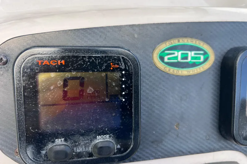 Slide: The Image of Tachometer display on 2006 Grady-White Tournament 205 boat dashboard. - 33