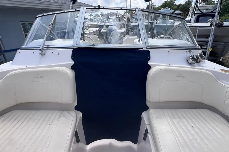 Slide: The Image of 2006 Grady-White Tournament 205 boat interior with white seating and blue cover. - 37