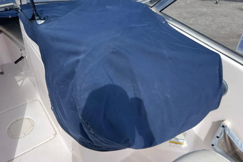 Slide: The Image of Blue canvas cover on Grady-White Tournament 205 boat dashboard, 2006 model. - 38