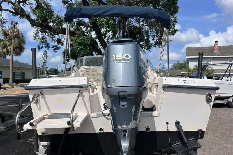 Slide: The Image of 2006 Grady-White Tournament 205 boat with 150 horsepower engine, parked outdoors. - 5