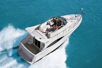 The Image of 2002 Carver 350 Mariner cruising on clear blue water. - 1
