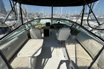 Slide: The Image of Interior view of 2002 Carver 350 Mariner yacht with seating and helm. - 12