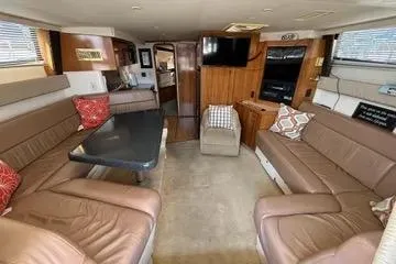 Slide: The Image of Interior of 2002 Carver 350 Mariner yacht with spacious seating and modern amenities. - 17