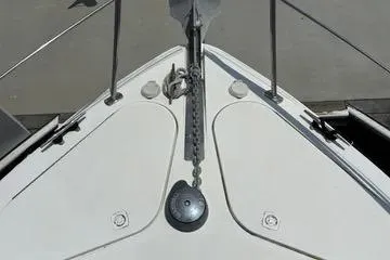 Slide: The Image of Bow of 2002 Carver 350 Mariner yacht with anchor chain and deck details. - 18