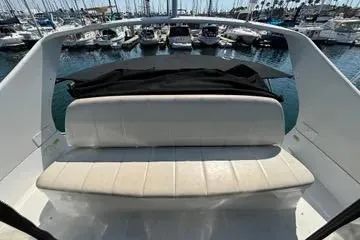 Slide: The Image of 2002 Carver 350 Mariner boat interior with seating, docked at marina. - 2