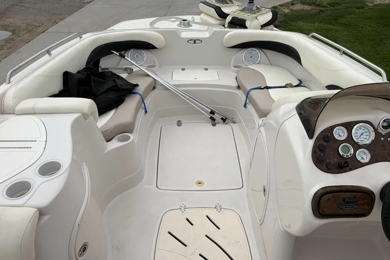 Slide: The Image of 2007 Tahoe 215 OB boat interior with seating, dashboard, and storage compartments. - 5