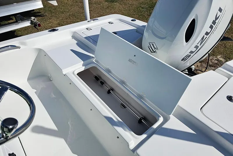 Slide: The Image of 2026 Sea Pro 172 Bay boat storage compartment with open hatch and key lock. - 28