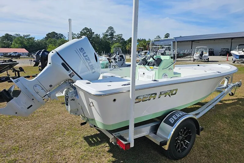 Slide: The Image of 2026 Sea Pro 172 Bay boat with Suzuki engine, featuring beige seating and sleek design. - 7