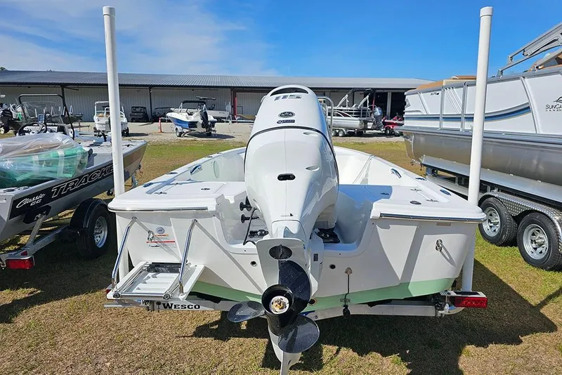 Slide: The Image of 2026 Sea Pro 172 Bay boat interior with mint green console and beige seating. - 8