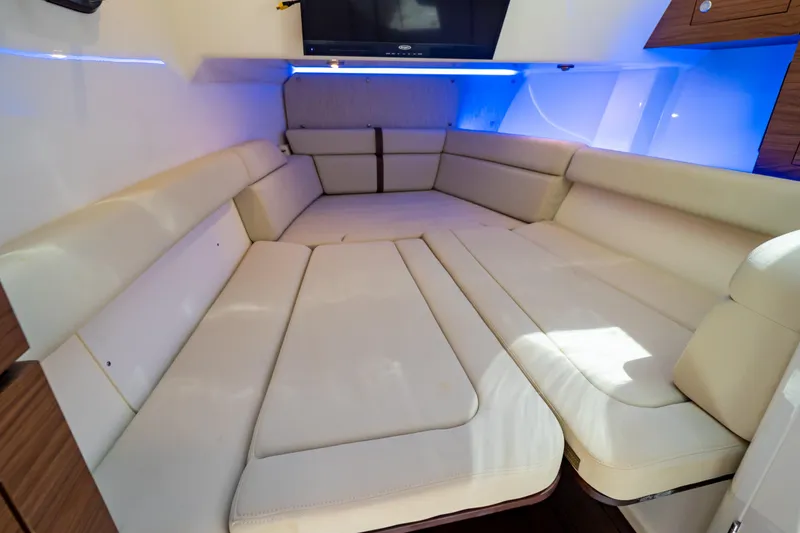 Slide: The Image of Luxurious interior cabin of 2019 Boston Whaler 350 Realm with plush seating and ambient lighting. - 37